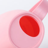 arrosoir en plastique rose