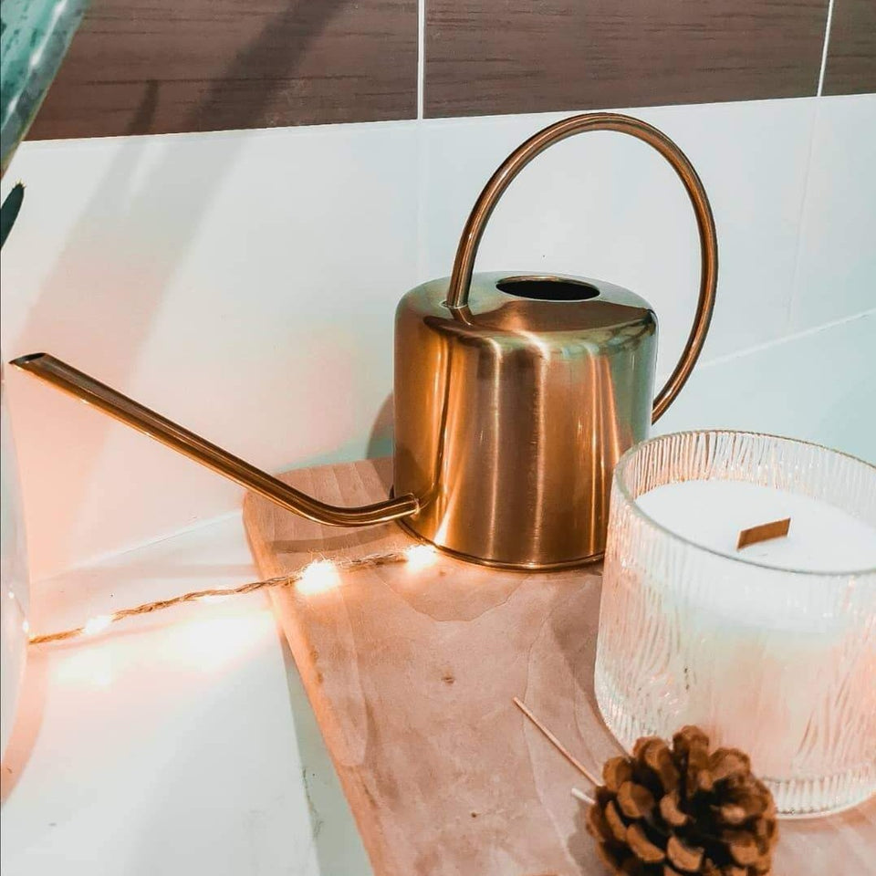 Designer gold watering can